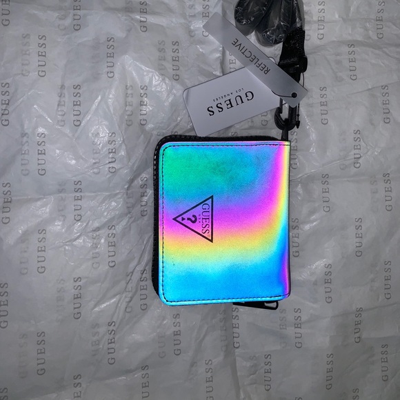Guess Handbags - Guess holographic zipper wallet.